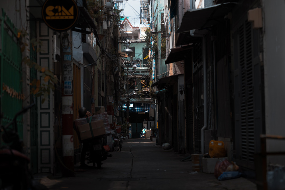 Street Photography - Child running in alley way