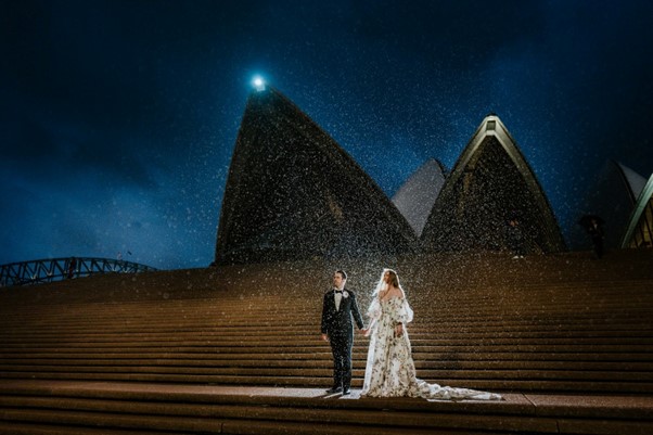 Wedding Photography - Wedding couple standing in front of the Opera House