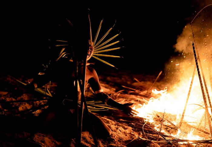 George Waimanu screams by the fire on the opening night of the Wogasia Spear Fight in a remote part of the Solomon Islands.