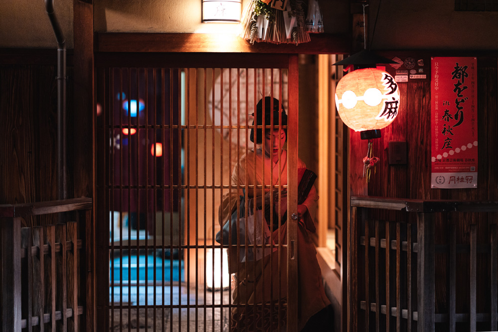 Street Photography - Geisha at house entrance